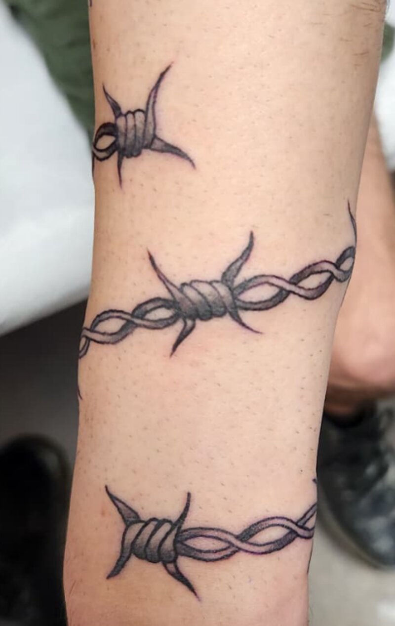Blackwork barbed wire armband tattoo by Mindcrusher Tattoo, Rogers Park Chicago