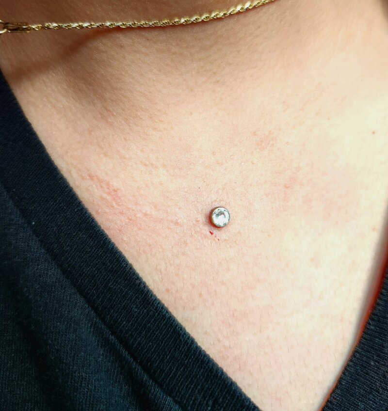 Chest sternum dermal piercing done at Mindcrusher Tattoo, Rogers Park Chicago