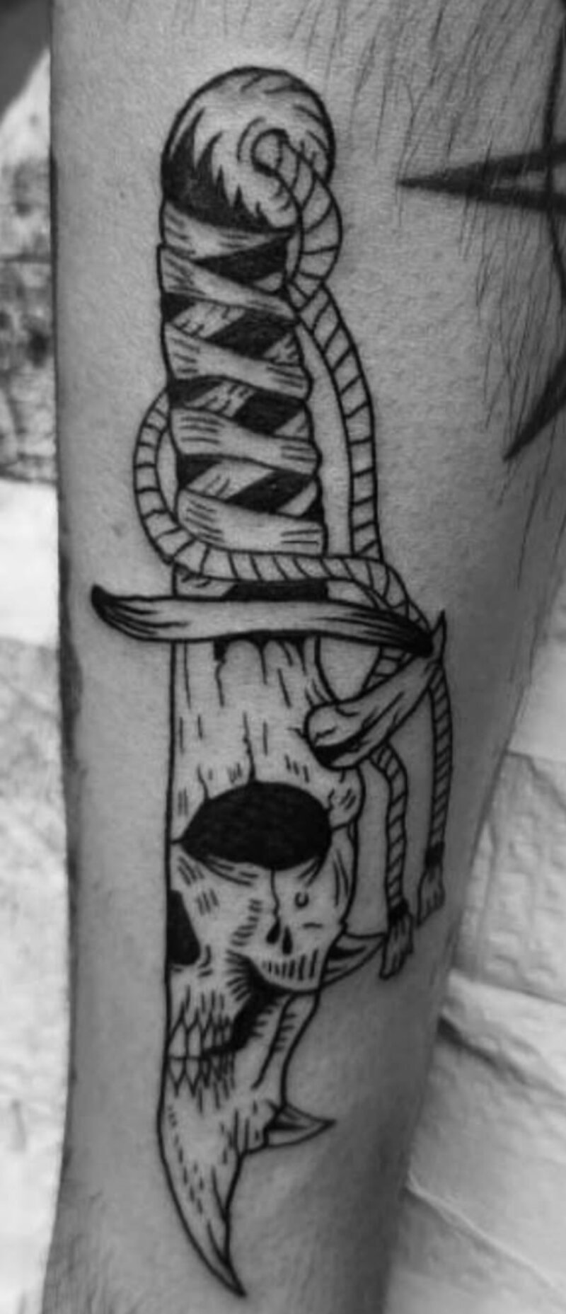 Traditional blackwork dagger and skull tattoo by Mindcrusher Tattoo, Rogers Park Chicago
