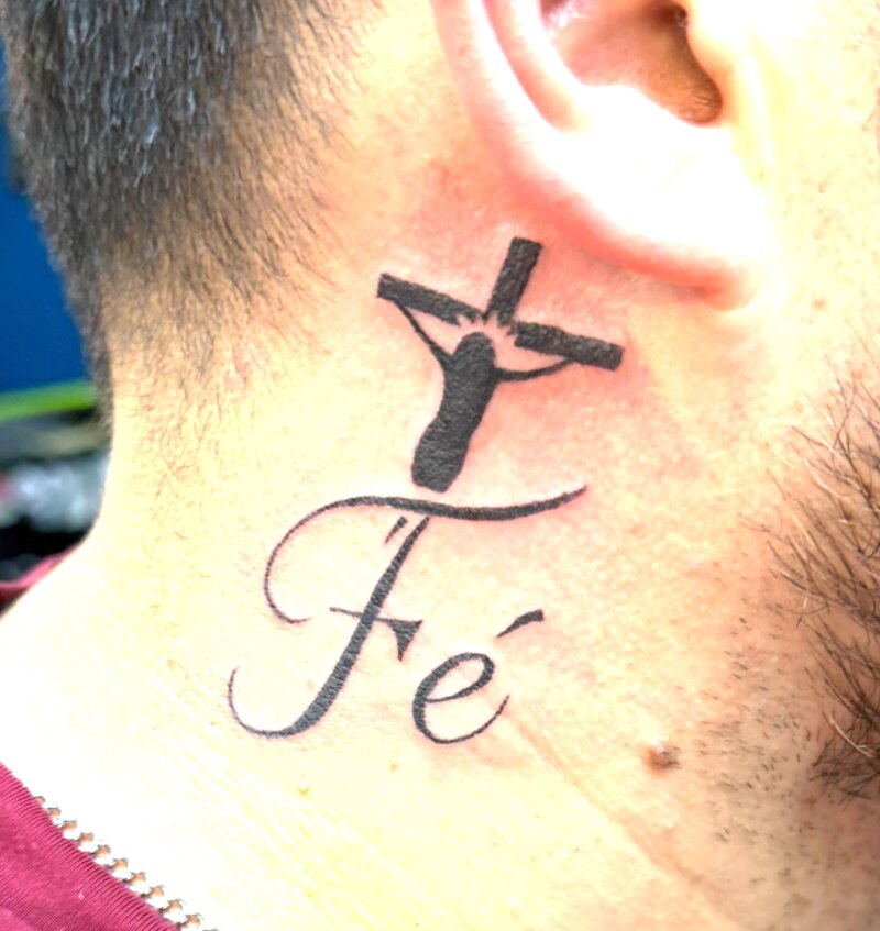 Script lettering cross tattoo by Mindcrusher Tattoo, Rogers Park Chicago