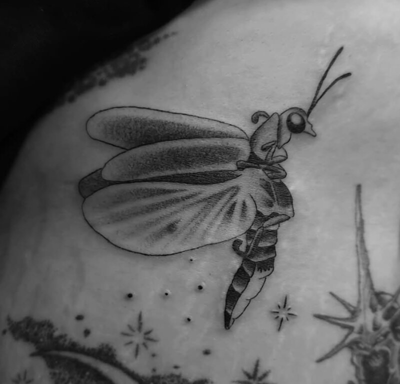 Black and grey firefly tattoo by Mindcrusher Tattoo, Rogers Park Chicago