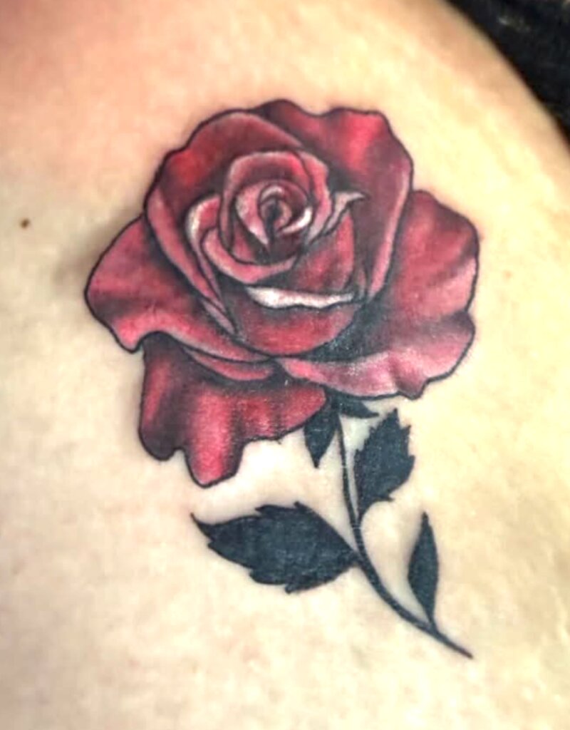 Color traditional red rose tattoo by Mindcrusher Tattoo, Rogers Park Chicago